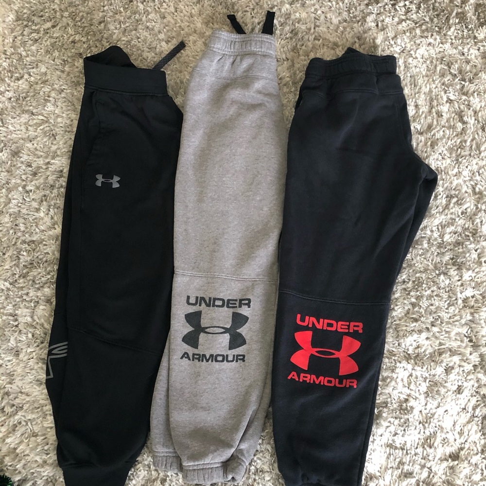 Three pairs of Under Armour sweat pants